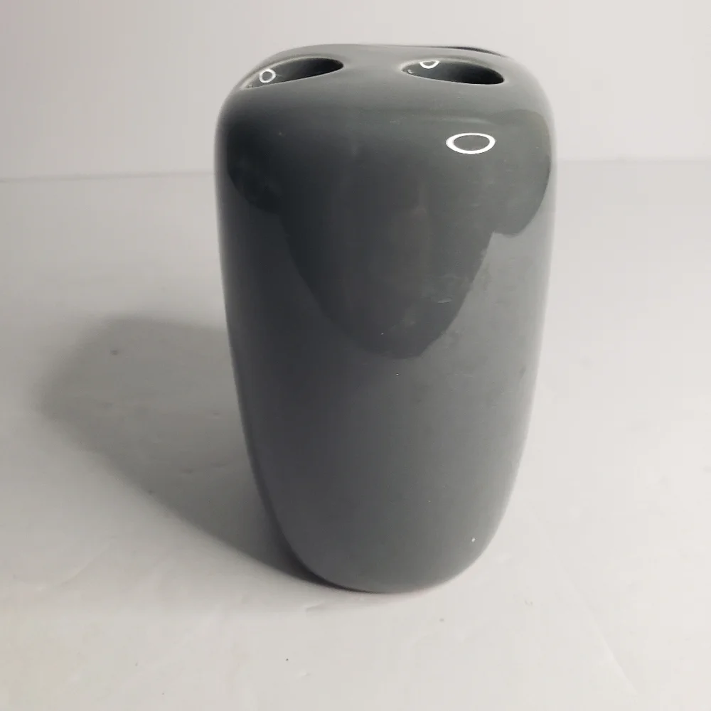 Ceramic toothbrush and toothpaste holder. 171